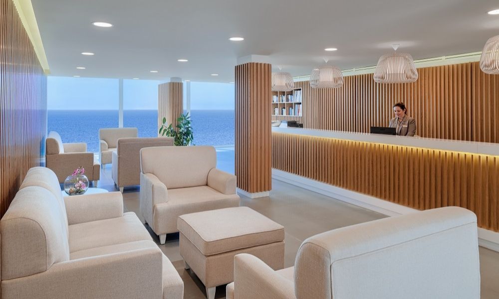 reception area with a friendly staff member on the desk