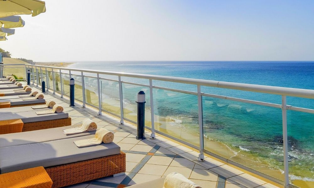 sunbeds placed near the waterfront