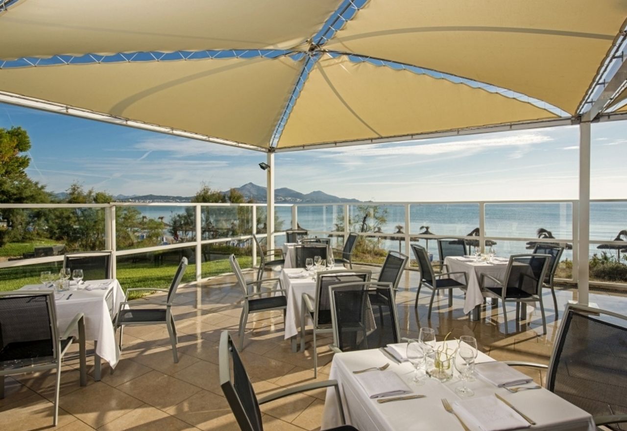 outdoor dining area with a view of the ocean