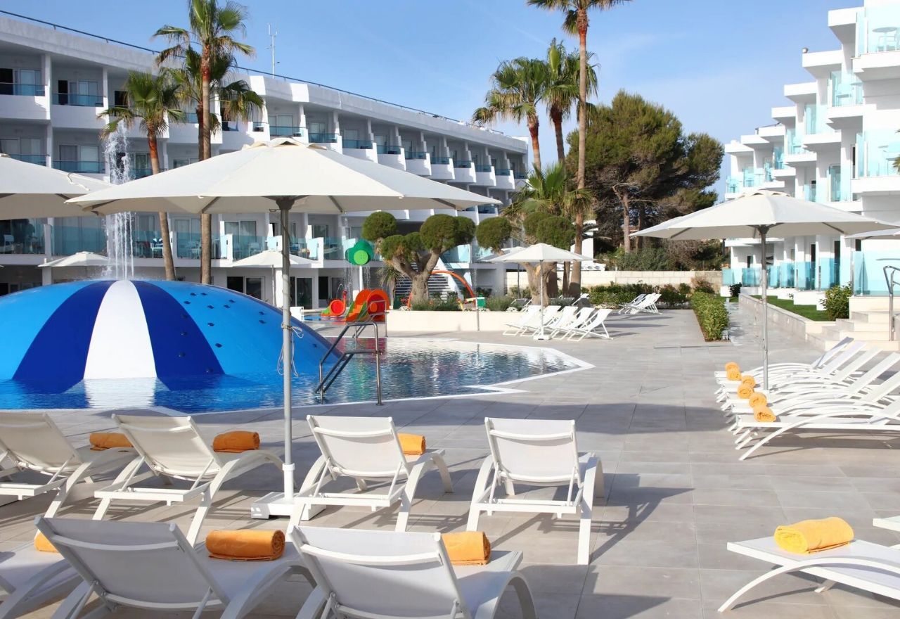sunbeds near the outdoor swimming pool
