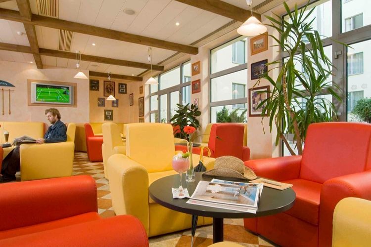 indoor lounge area with the football game on