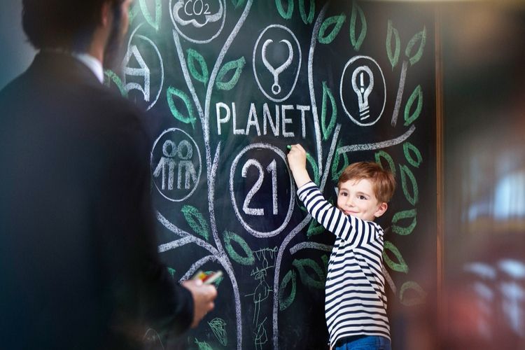 environmental mural being drawn by a child