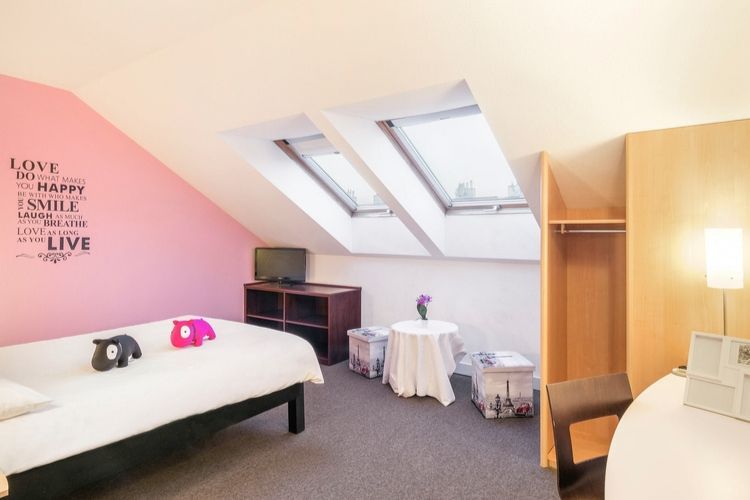 single girls room with writing decal on the wall