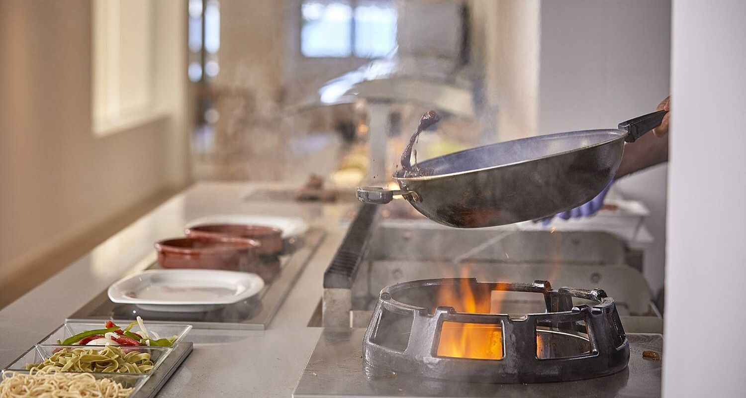 frying pan over an open flame