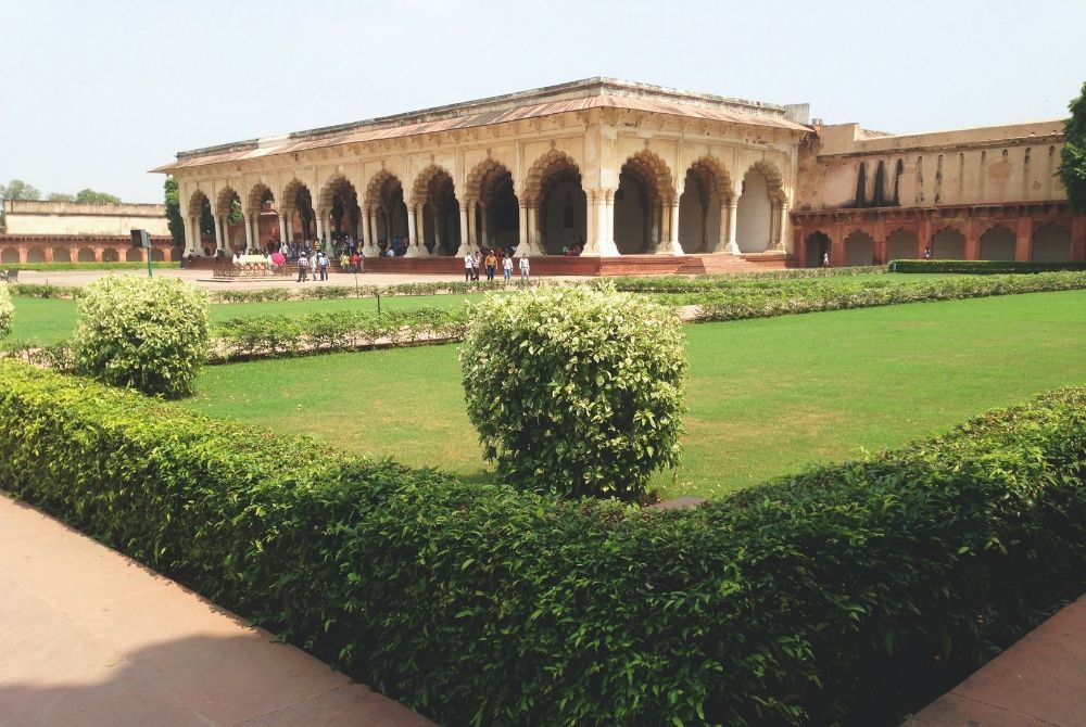 Hedges and greenery nearby some beautiful architecture