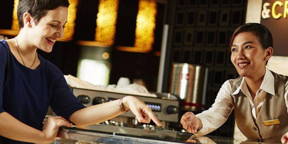 friendly staff member interacting with hotel guest