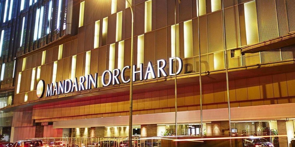 Mandarin Orchard hotel exterior with name plastered on the side in big letters