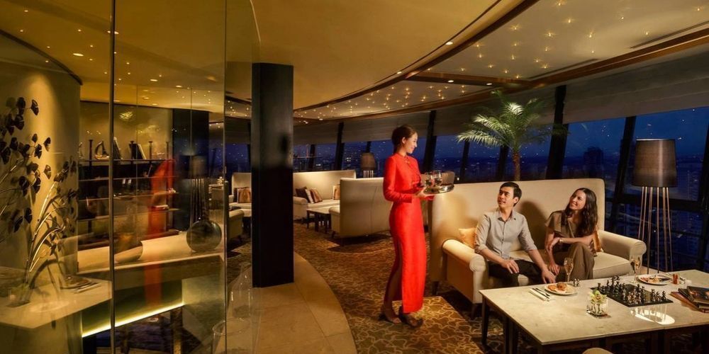 friendly staff member interacting with couple