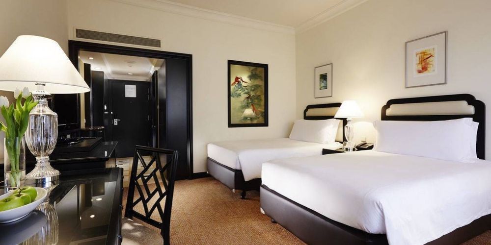 large twin beds with white sheets