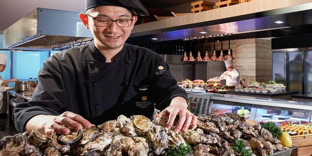 smiling chef preparing seafood