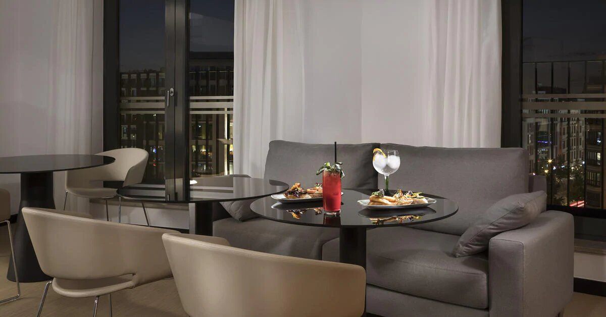 lounge area in the hotel suite - Melia Berlin accessible hotel