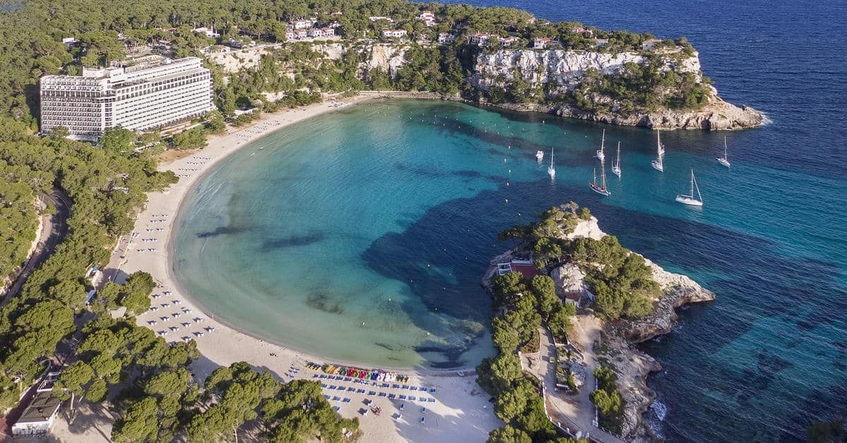 aerial view of the hotel, showing its location next to the beach