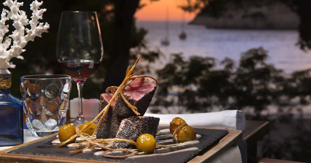 delicious and fresh food being prepared with a sunset backdrop
