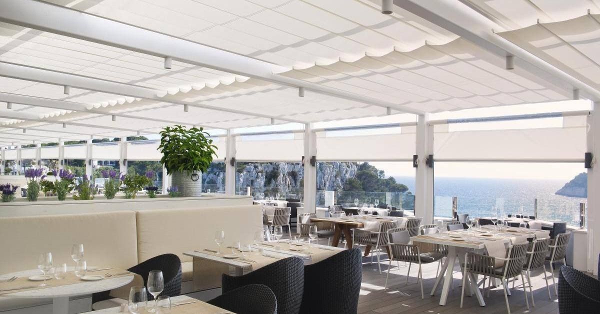 outdoor dining with a canopy overhead