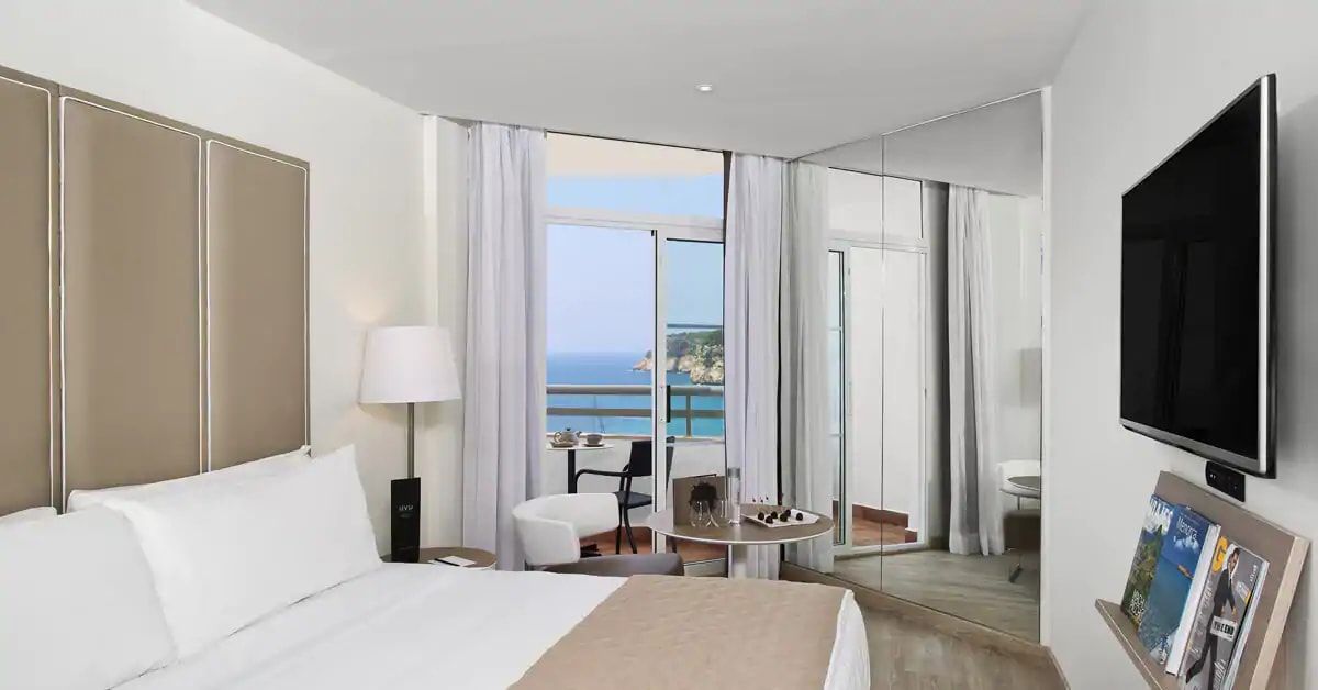 family room providing a balcony and flat screen tv