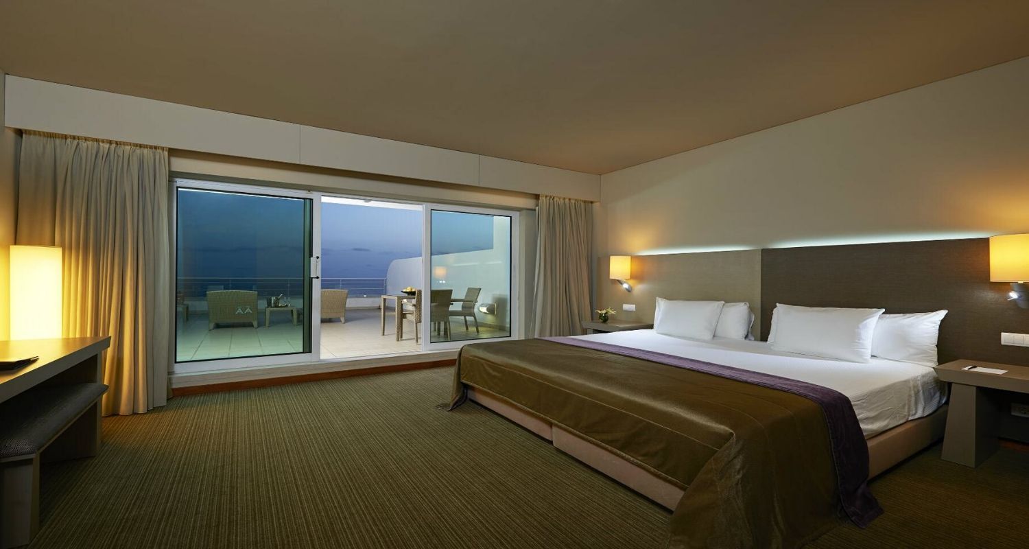 Massive hotel room with a king sized bed and large balcony terrace