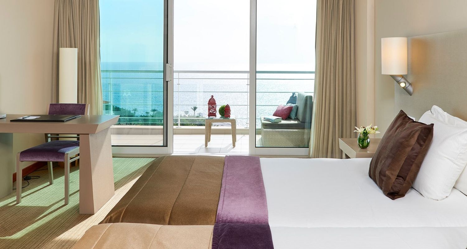 spacious bedroom with a balcony terrace