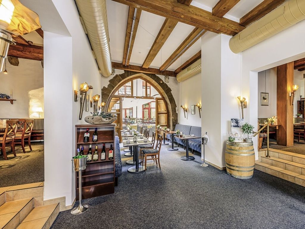 indoor dining area that is available near the hotel entrance