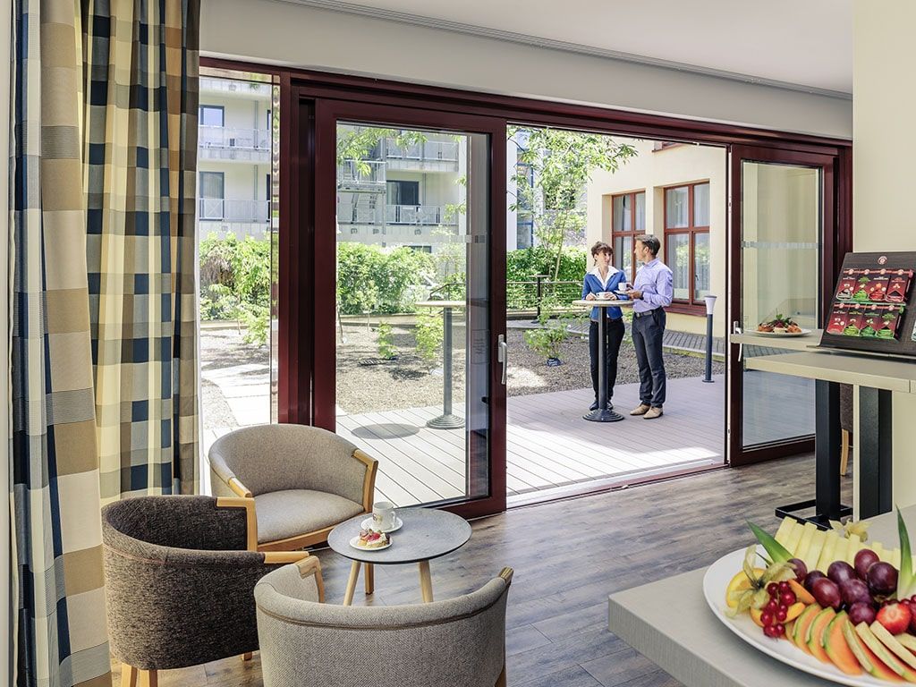 event dining space with hotel guests enjoying the weather outside