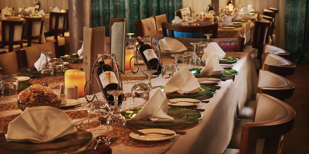 dinner table with delicious food and wine