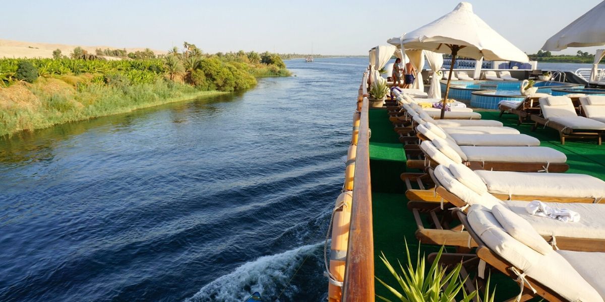 looking over the side of the ship at the river