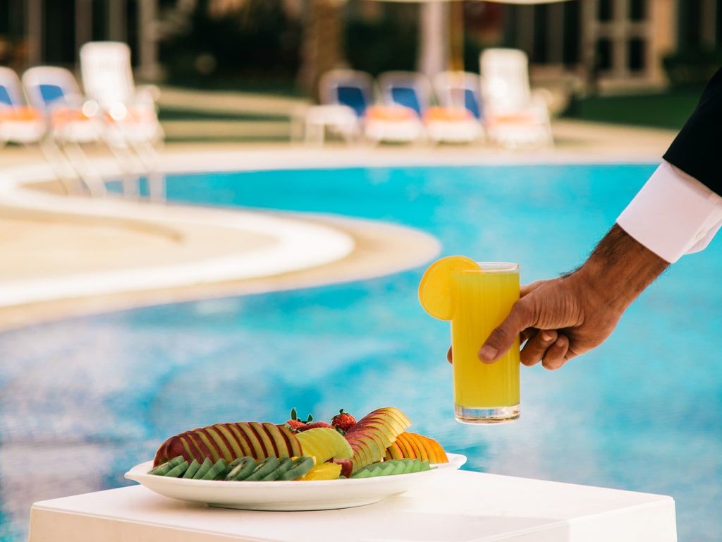 orange juice being delivered poolside