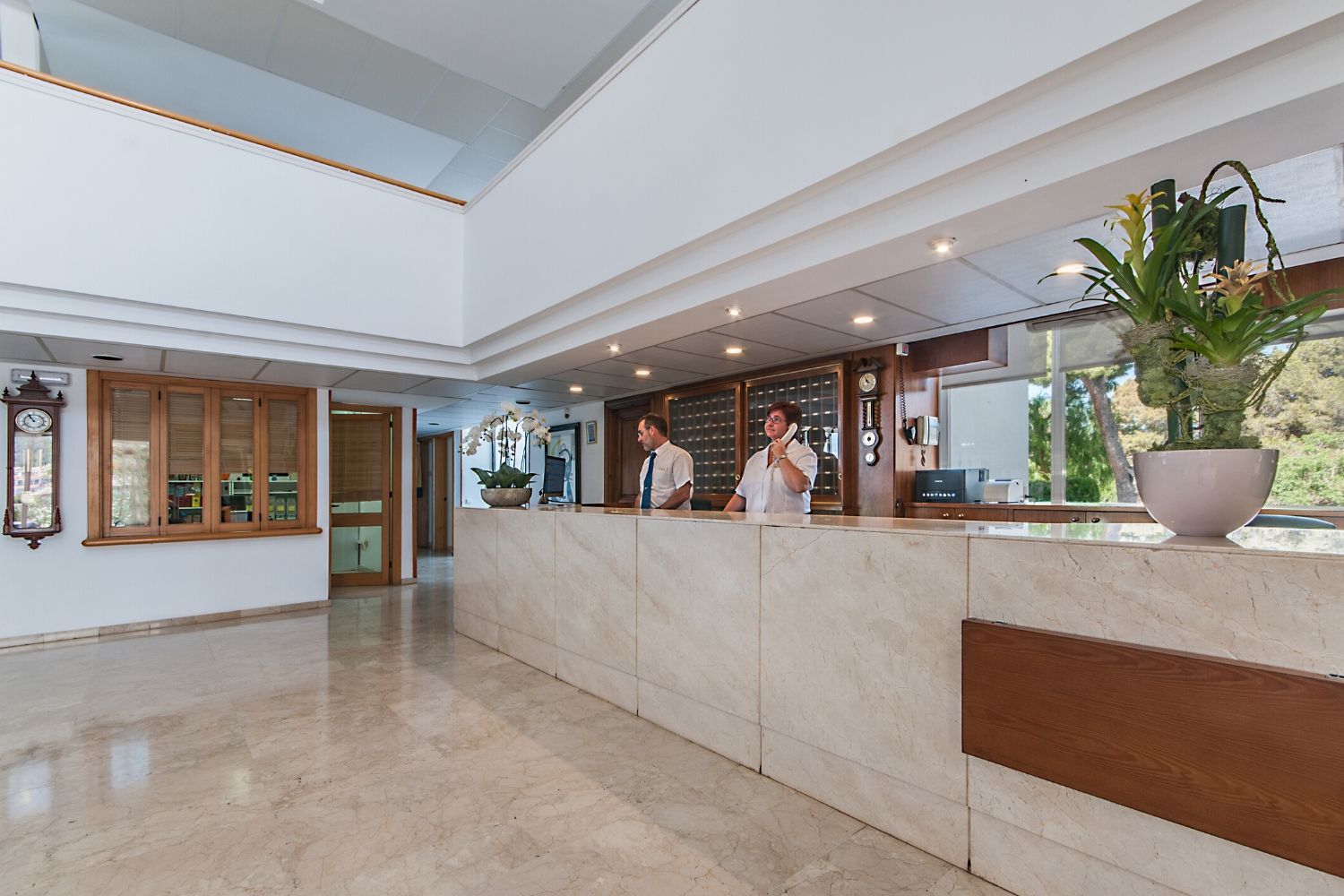 spacious reception lobby and check-in desk with friendly staff waiting to help