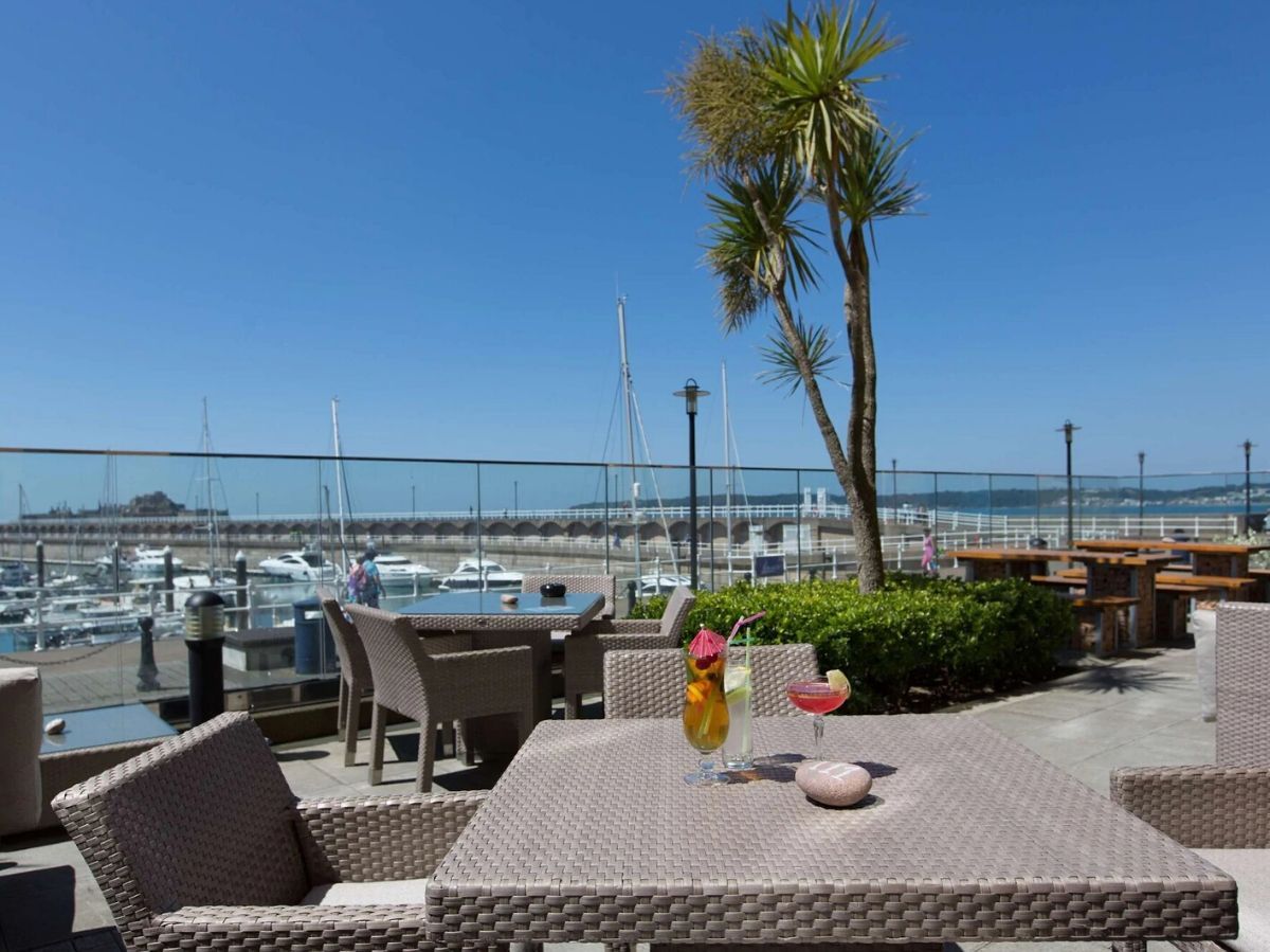 outdoor dining with a view of the pier