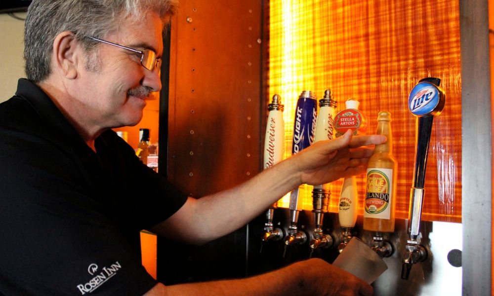 friendly bartender pouring drinks