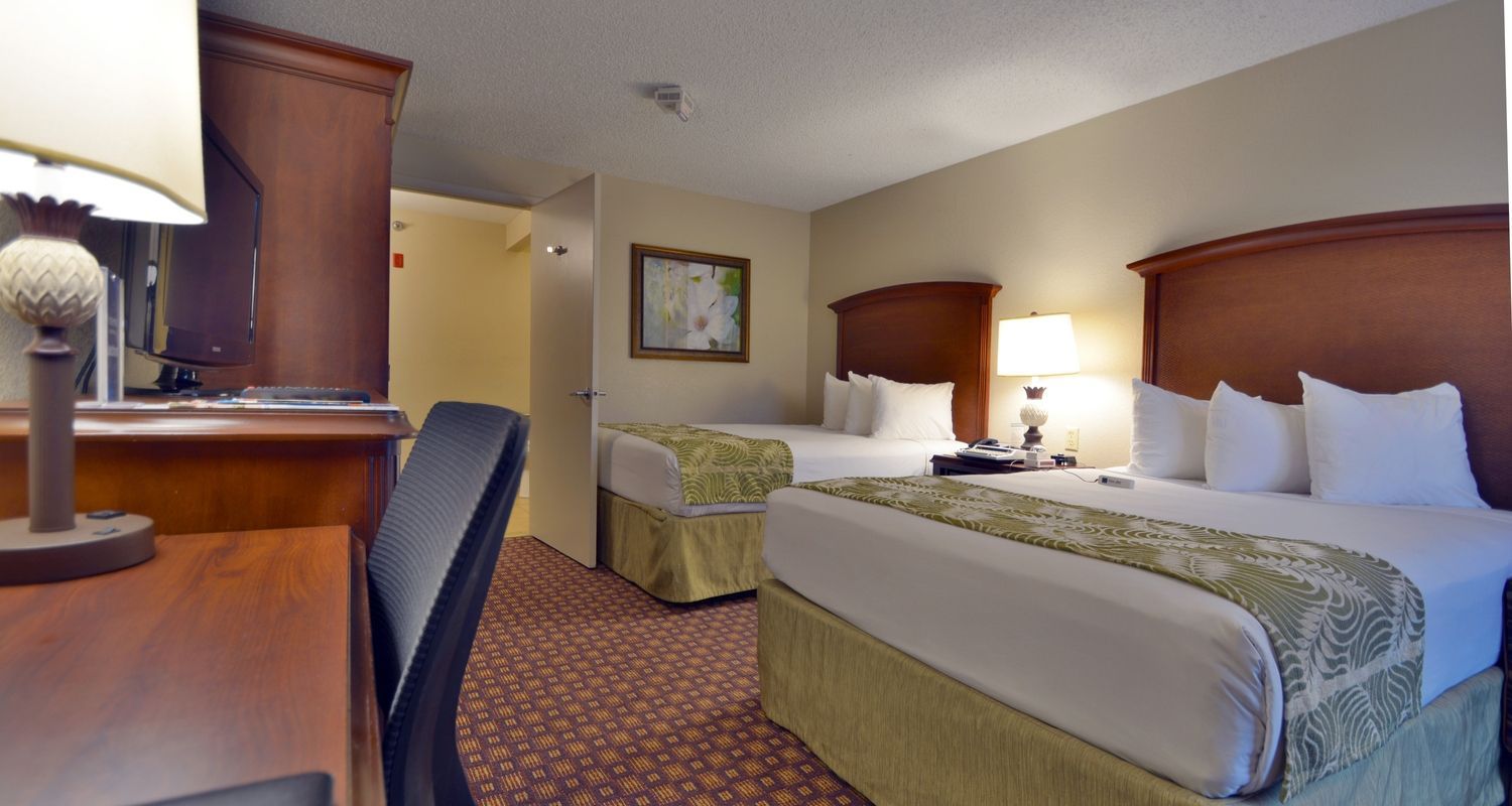 large hotel room with two queen beds