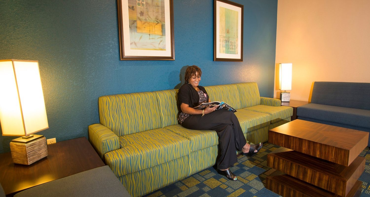 hotel guest enjoying the comfy seats in the waiting room