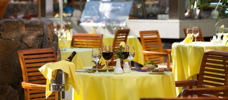 outdoor dining space with a chilled bottle of champagne