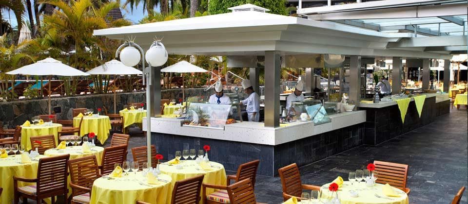 outdoor dining area with a pool bar
