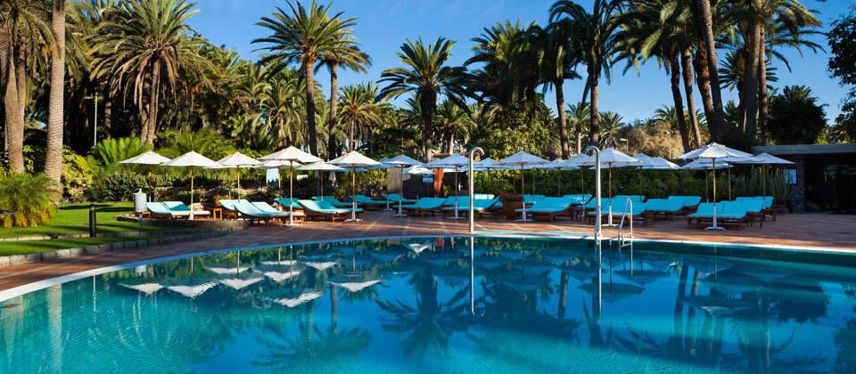 sunbeds near the outdoor swimming pool