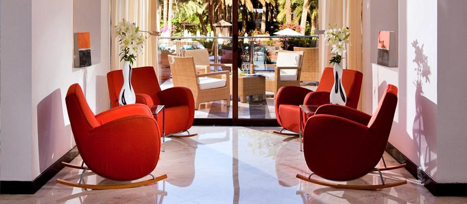 indoor seating area with red chairs