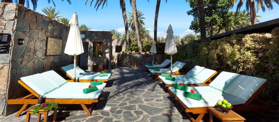 sunbeds in a secluded spot offering shade from the sun