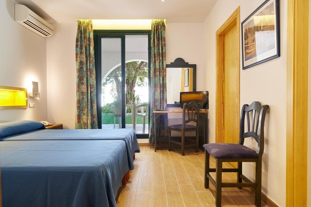 twin beds pushed together with a terrace