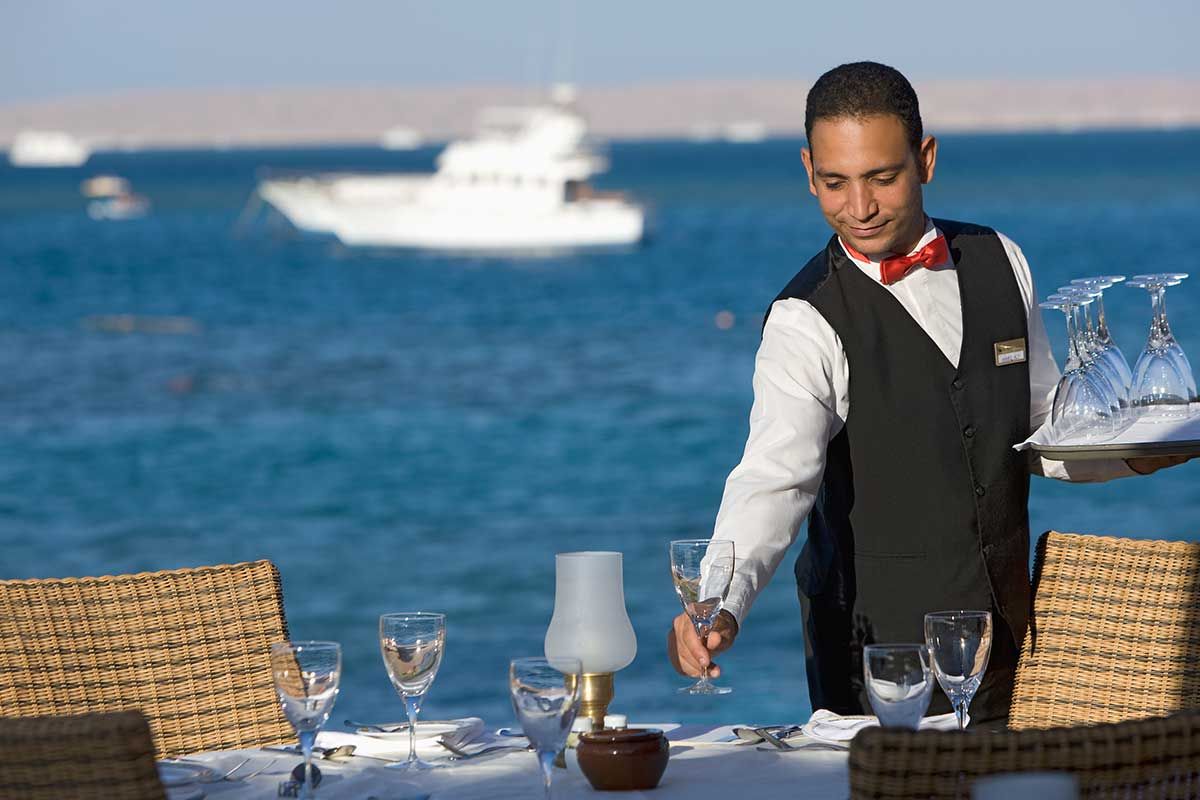 friendly wait staff preparing the table