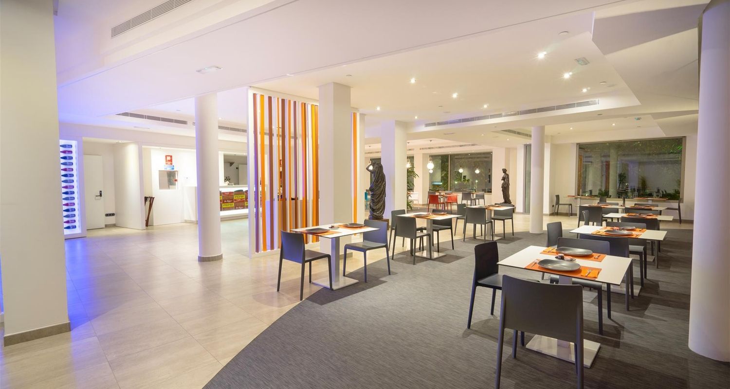 spacious indoor restaurant with dimmed lighting