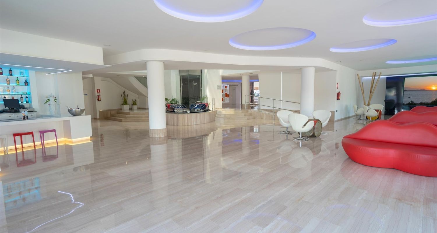 indoor bar and lounge space with lip styled chairs