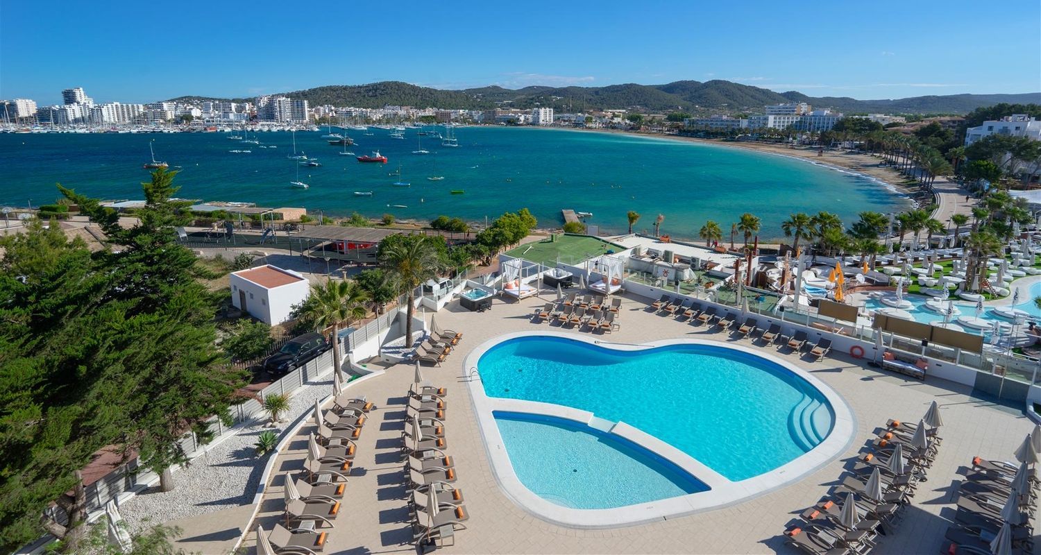view from the hotel of the outdoor swimming pool and ocean