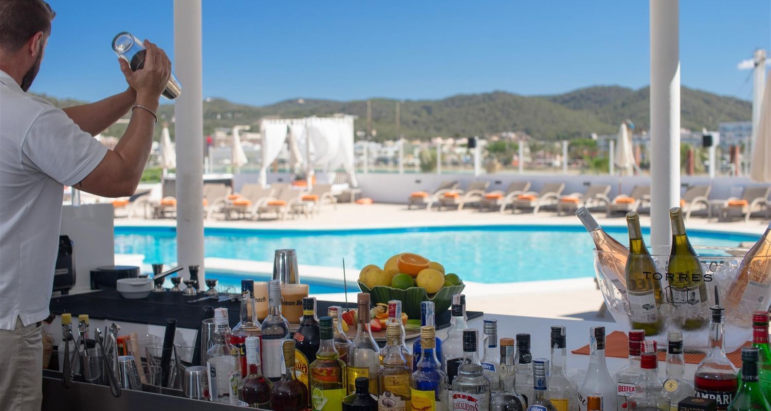 bartender mixing drinks at the pool bar