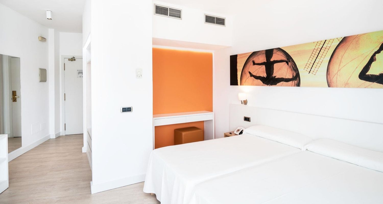 spacious hotel room with twin beds pushed together