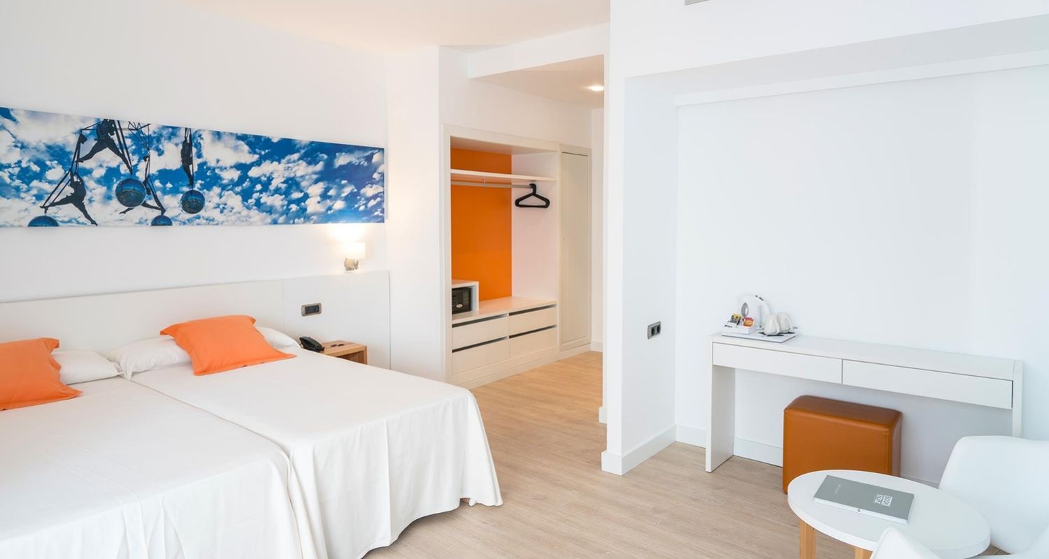 spacious hotel room with twin beds pushed together