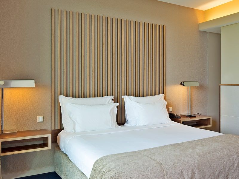 spacious hotel room with a large bed