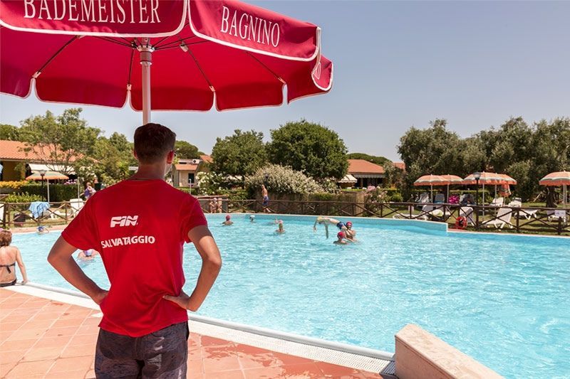 lifeguard watching over the outdoor swimming pool