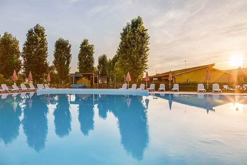 outdoor swimming pool at sunset