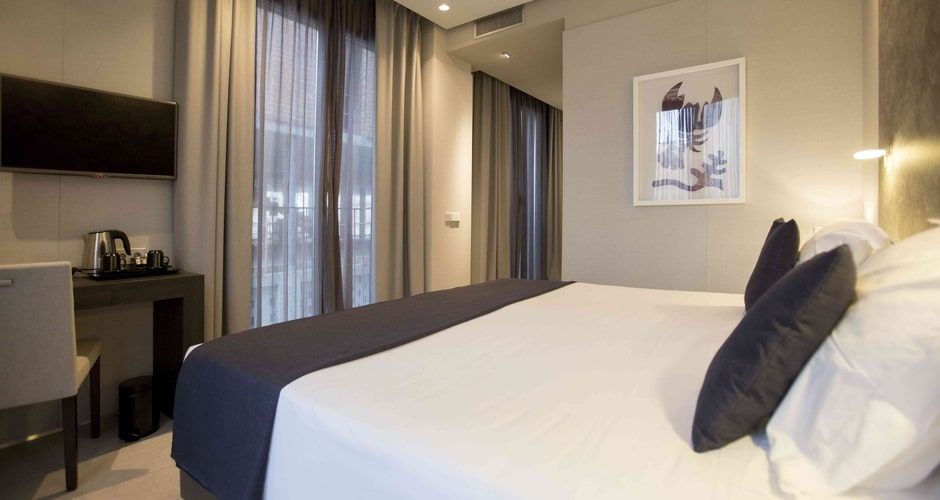 spacious bedroom with a king size bed