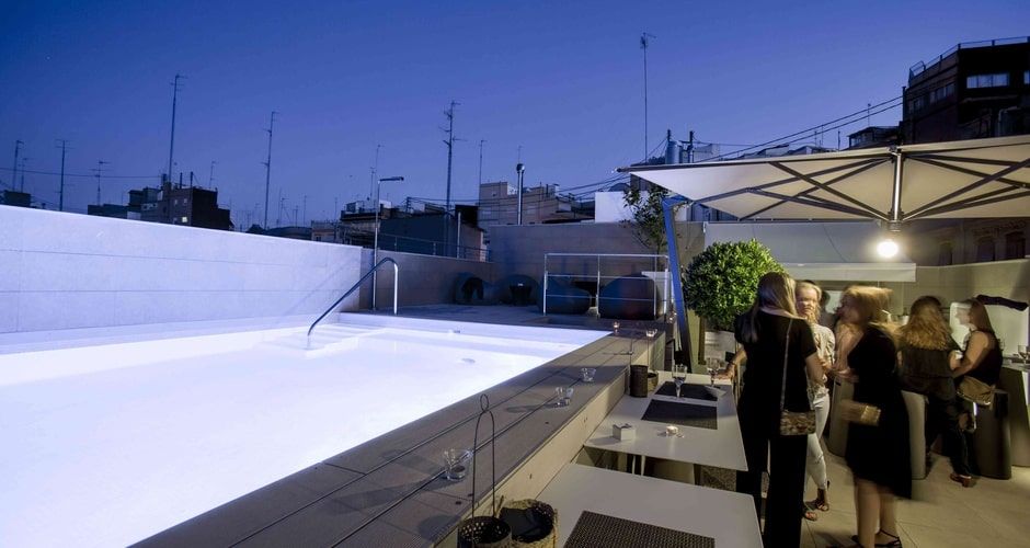 outdoor rooftop swimming pool and hotel guests