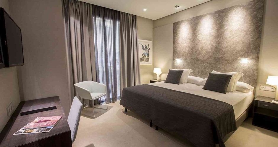 spacious bedroom with warm lighting